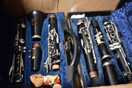 Two cased clarinets, Boosey & Hawkes and Ruddall, Carte