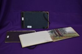 Three early 20th Century artist's sketch pads, all containing amateur watercolour interpretations of