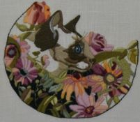 Artist Unknown, A 20th century needlework, A siamese cat within flowers, framed, mounted, and
