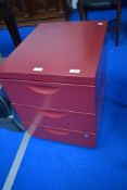 A set of metal filing drawers, burgundy finish