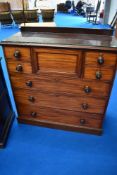 A Victorian mahogany 'Scotch' chest of drawers, having concealed central drawer flanked by two short