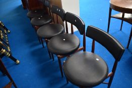 A set of five vintage designer teak dining chairs by G Plan, vinyl covered circular seats (sold as