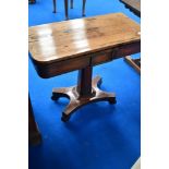 A Victorian rosewood fold over card table