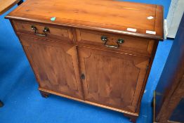 A modern yew wood side cabinet