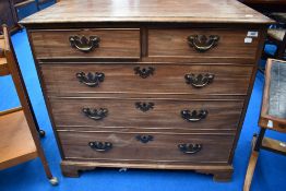 A 19th Century mahogany chest of two over three drawers having Georgian style handles and bracket