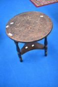 A Victorian carved top occasional table, diameter approx. 40cm
