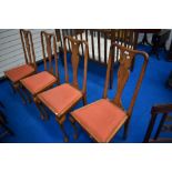 A set of four early 20th Century oak dining chairs having Queen Anne style legs