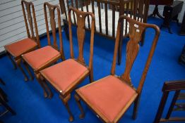 A set of four early 20th Century oak dining chairs having Queen Anne style legs