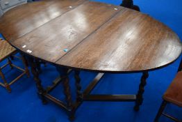 An early 20th Century oak twist gateleg dining table having oval top