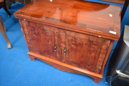 A reproduction yew wood TV cabinet