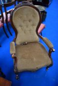 A 19th Century easy chair having scroll frame and button back dralon upholstery