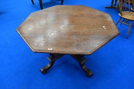 A Victorian oak dining table having octagonal top on quatrefoil base, bought from the clearance sale