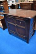 A vintage Ercol or similar narrow dresser base/side cabinet