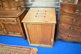 An early 20th Century golden oak collection box of large proportions, originally from Blackburn