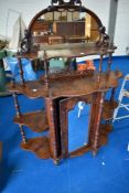 A 19tj Century mahogany chiffoneir of nice proportions, with whatnot style shelves to side and top