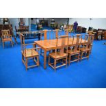An Oriental hardwood dining table and set of eight (six plus two) dining chairs