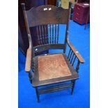 A 19th Century stained frame armchair having spindle back and arm supports