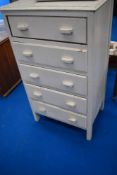 A vintage painted chest of five drawers