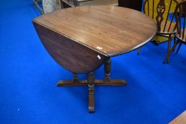A mid to late 20th Century mid/dark stained Ercol or similar gateleg table