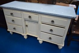 A 19th Century pained pine sideboard having later formica top