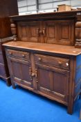 A traditional mid/dark stain Ercol or similar buffet sideboard