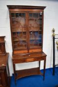 An Edwardian mahogany and inlaid display cabinet in the Sheraton style with astral glazed display