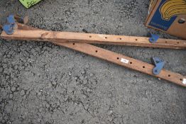 Two wooden and metal clamps