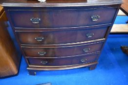 A reproduction Regency style mahogany bow fronted bedroom chest of four long drawers