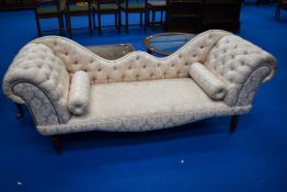 A reproduction double ended chaise longue having cream upholstery
