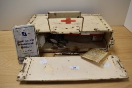 A mid-20th Century painted wood First Aid box with contents, 12cm x 22cm x 42cm overall