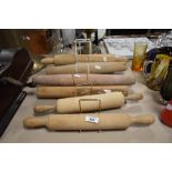 Six vintage and antique primitive wooden rolling pins.