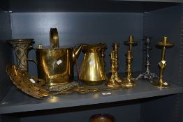 An assorted collection of brassware, candlesticks, including a pair of Gothic design quatrefoil