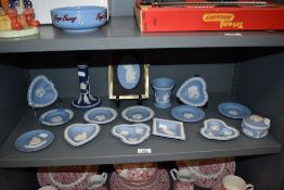 A collection of Wedgwood Jasperware pin dishes, trinket dish, vase, candlestick and similar.