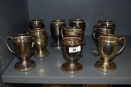 A group of ten silver plated punch cups, with gadrooned bases, measuring 11cm tall