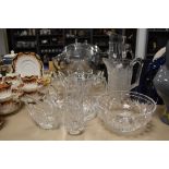 A variety of glassware, including cut glass jug and vase and a heavy art glass bowl.