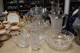 A variety of glassware, including cut glass jug and vase and a heavy art glass bowl.