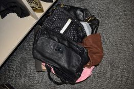 An assortment of ladies bags, all good quality, some with dust covers.