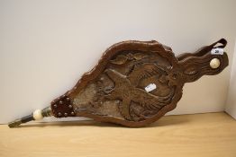 A pair of late 19th/early 20th Century oak hand bellows, the boards carved with birds of prey,