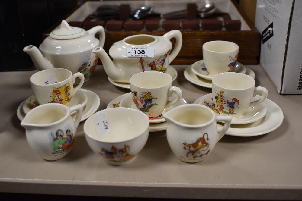 An early 20th century dolls tea service, having nursery rhyme transfer patterns to each piece,