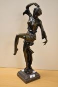An Art Deco bronze sculpture, in the manner of Chiparus, of a dancing lady, raised upon a stepped