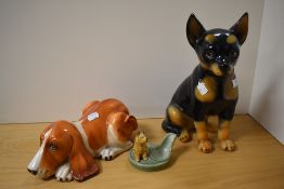 A Goebel style pottery Doberman statue, 35cm tall, together with a hound of similar design, and a
