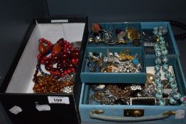 A mixed lot of vintage costume jewellery, including early plastic cherry amber effect beads and