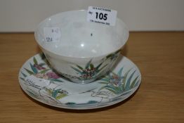 A Japanese egg shell tea bowl and saucers, having hand painted floral scenes with stork with six