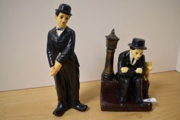 Two vintage ceramic statues of Charlie Chaplin, the tallest measuring 29cm
