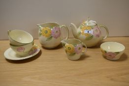 A Susie Cooper design part tea service, hand painted with flowers, and comprising seven pieces