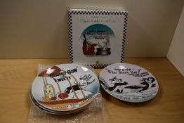 Four Warner Bros Looney Tunes display plates, one Simpsons plate and a Flinstones plate.