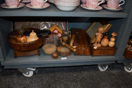 An assortment of treen, including carved owl, turned bowls, whistles, tray and more.