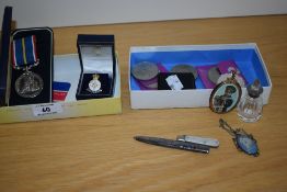 A cased National Service 1939-1960 medal, an enamelled HM Armed Services Veteran badge, plus other