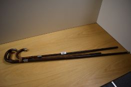 Three antique bamboo walking canes, including some with hallmarked silver cuffs of detail to