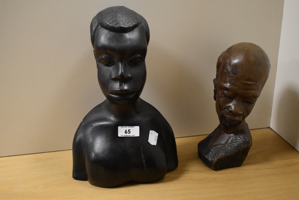 Two African hardwood carved busts, to include an intricately carved bearded man, the largest
